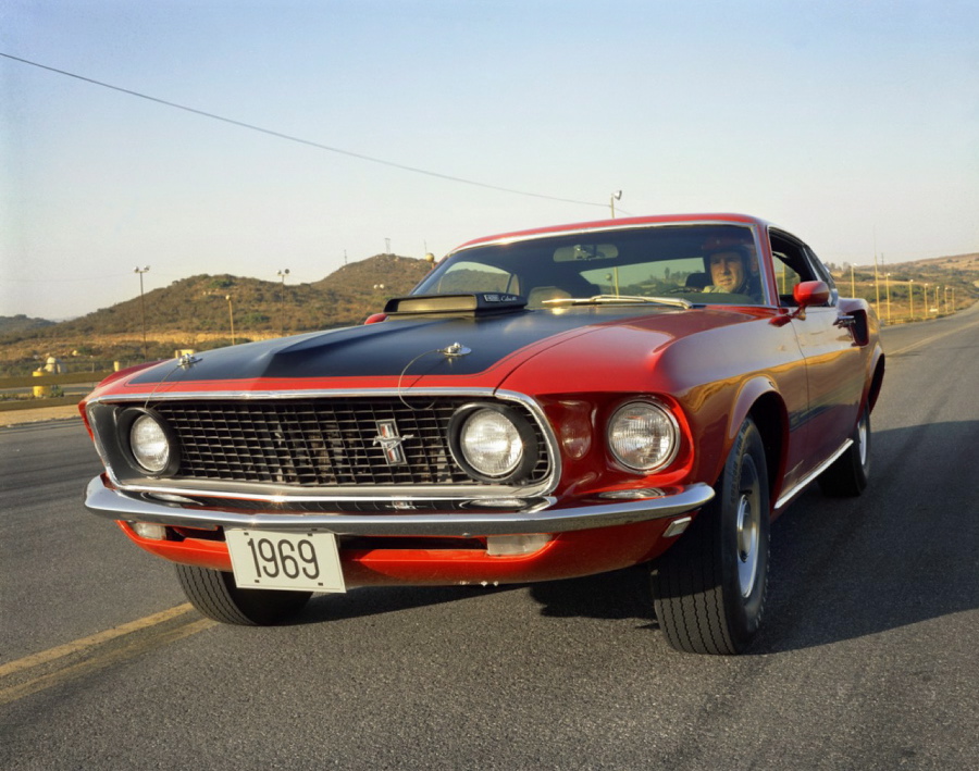 Ford beefed up the Mustang in 1969, adding length, width, and weight to the pony car. The Mach I was also added, with distinctive striping, dual exhaust pipe and a 