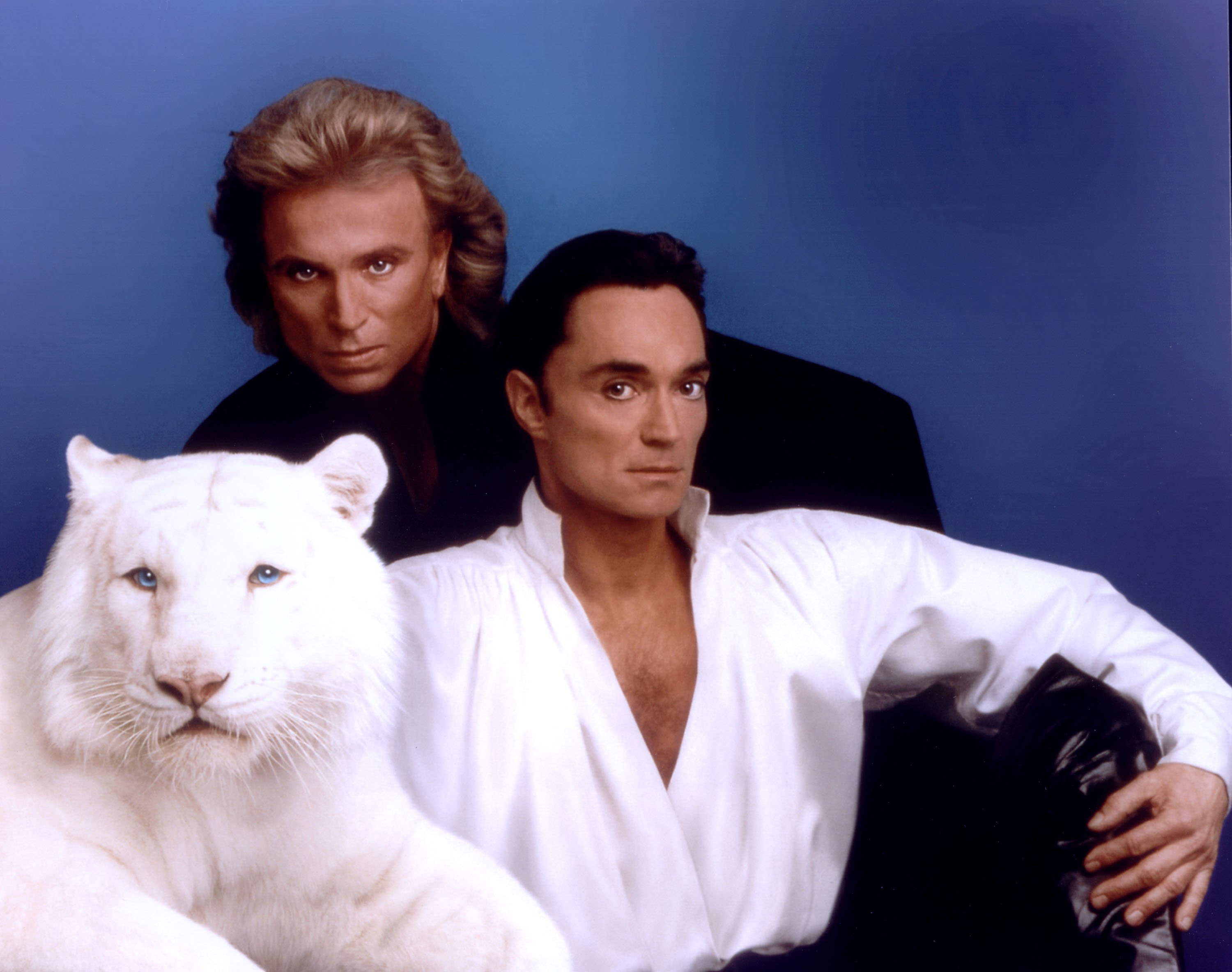 World-renowned illusionists and conservationists Siegfried & Roy pose with their white tiger in this undated photo.