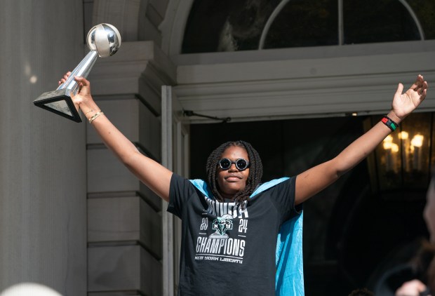 Fans and New York Liberty players celebrate at New York City Hall following a ticker-tape parade in Manhattan's 'Canyon of Heroes' following the Liberty's WNBA Championship win on Thursday, Oct. 22, 2024, in New York City. (Barry Williams for New York Daily News)