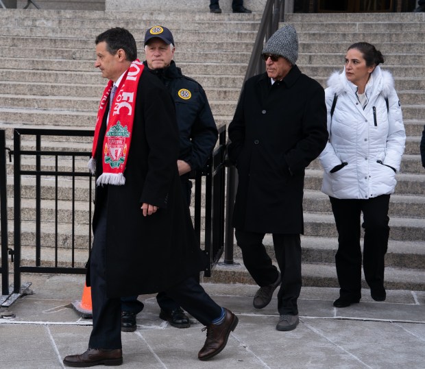 Erden Arkan, grey hat, leaves Manhattan Federal Court after pleading guilty to bundling campaign donations Friday, Jan. 10, 2025 in Manhattan, New York. (Barry Williams/ New York Daily News)