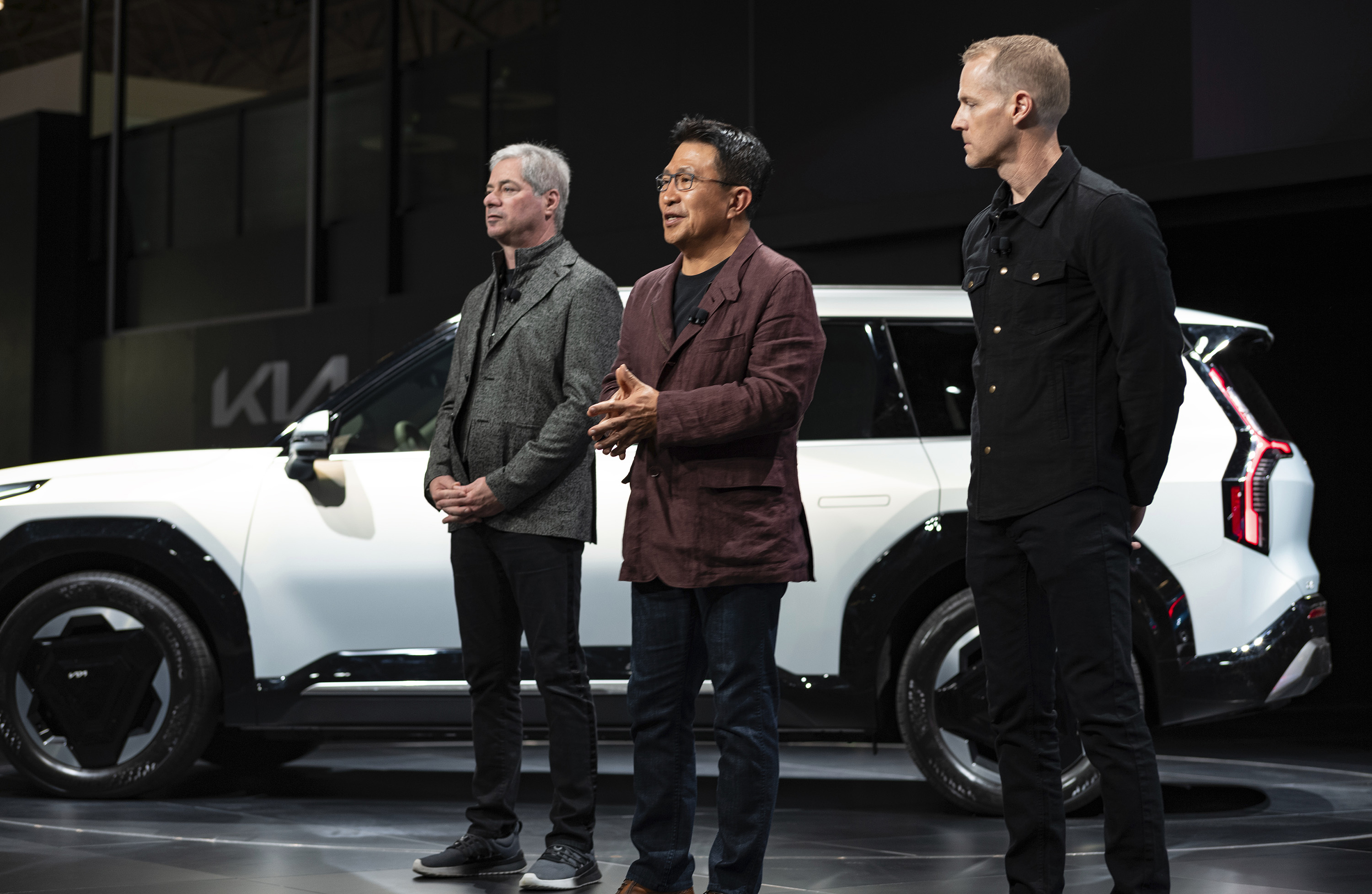 From left, Russell Wager, Vice President, Marketing for KIA America, Sean Yoon, President and CEO of Kia North America and America, and Kurt Kahl Senior Design Manager KIA, stand after the introduction of the EV9 at the New York International Auto Show in New York on Wednesday, April 5, 2023.